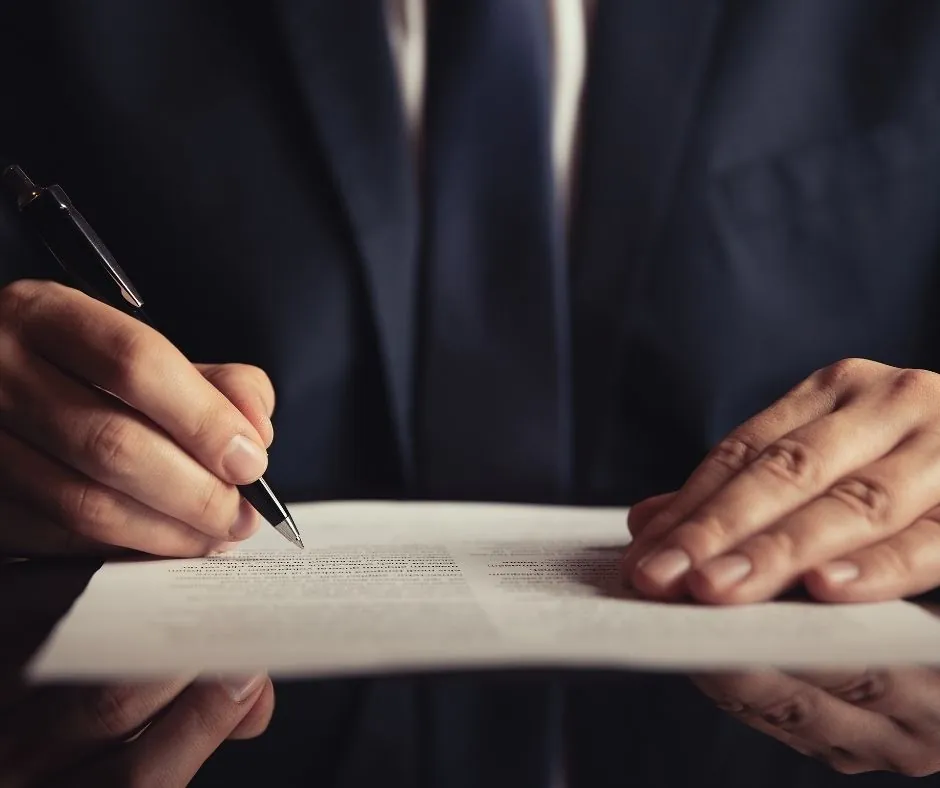 MSPB appeals vs. EEO complaints lawyer taking notes on client case